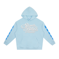 Premium powder-blue heavyweight hoodie featuring an elegant white Stoner Billy’z Apparel Co. script logo across the chest, blue sleeve graphics, relaxed drop shoulders, and an oversized streetwear fit.